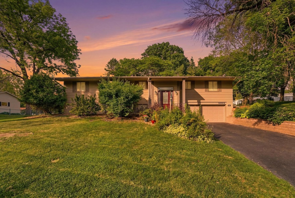 Two-story home at dusk at 12913 Eagle Ridge Dr, Burnsville, Minnesota